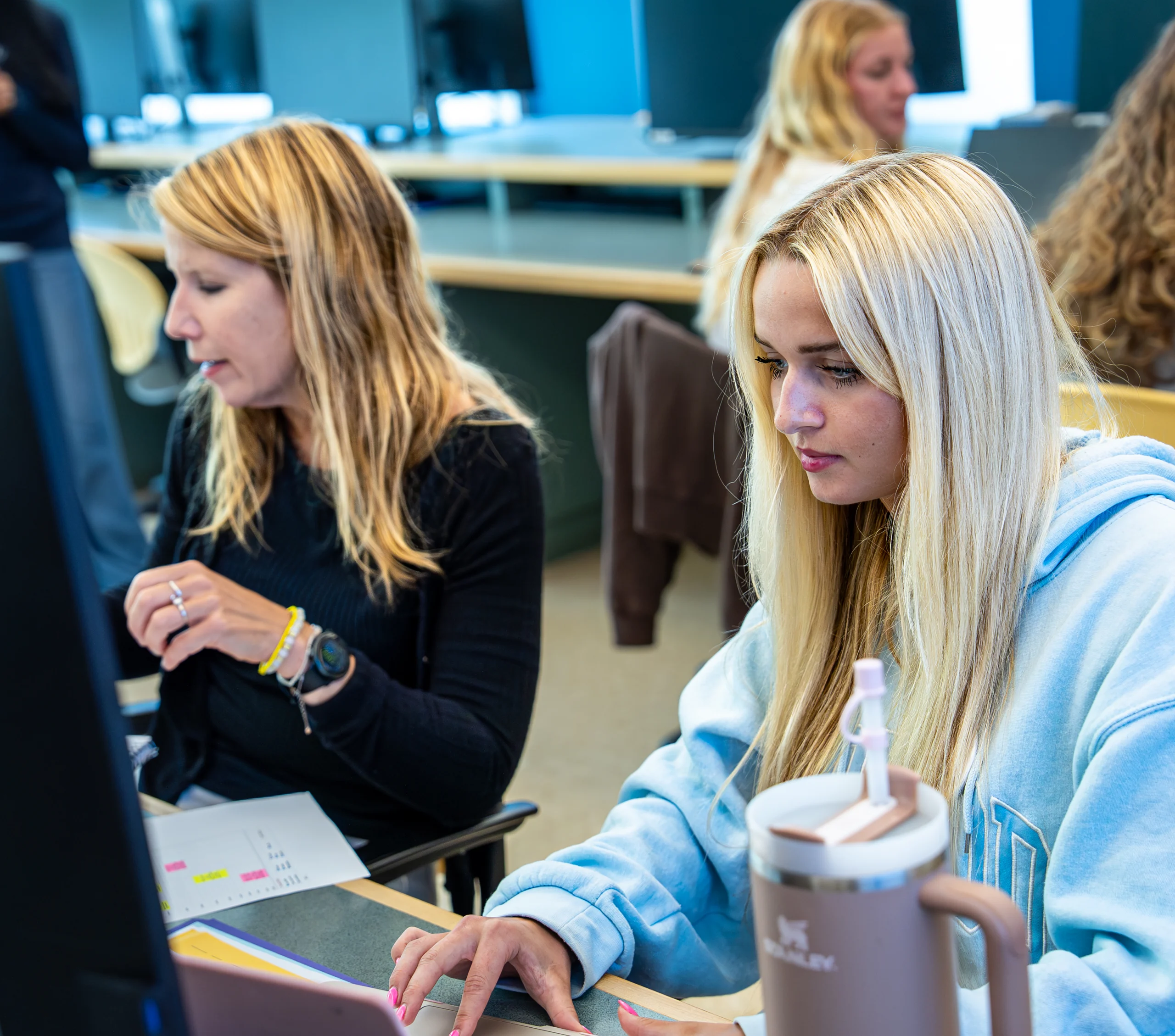 Female student working in class on computer.